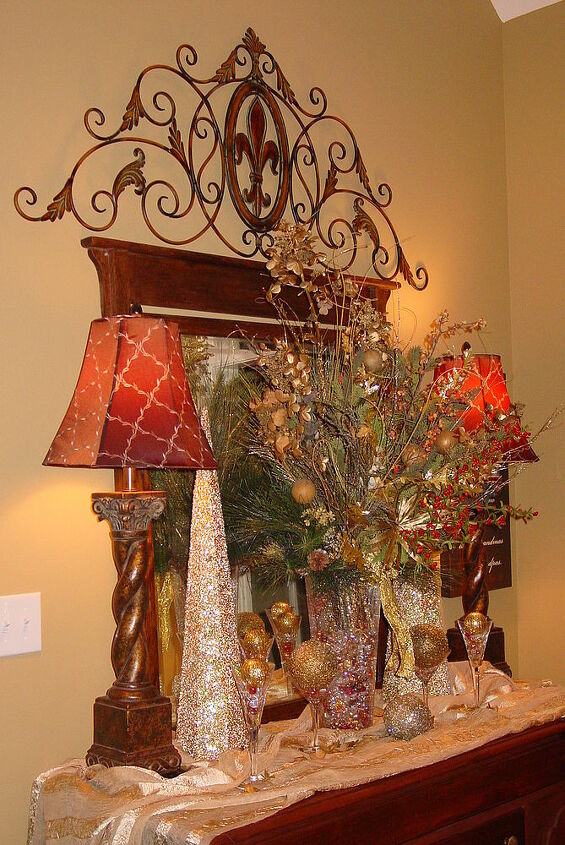 my family room sideboard all decked out for christmas, seasonal holiday d cor, The mirror was my great grandfather s and the decorations are things I already had I recently found the lamps at a resale shop After repairing a couple of small cracks and coloring with markers they look new to me