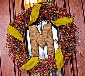 easy monogram wreaths, crafts, seasonal holiday decor, wreaths, Using the color of the moment chartreuse wrap ribbon around a store bought grapevine wreath with added berry sprays Letters like this M can be found at Michaels Hobby Lobby JoAnns etc This letter is wrapped in ordinary twine