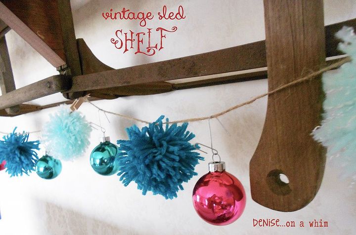 a slightly broken sled gets new life as a wall shelf, repurposing upcycling, seasonal holiday decor, shelving ideas, Coordinating pom garland hanging from the sled shelf