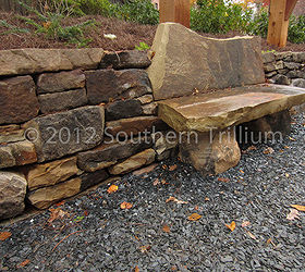 timber frame garden structure, A detail view of the stone wall and bench