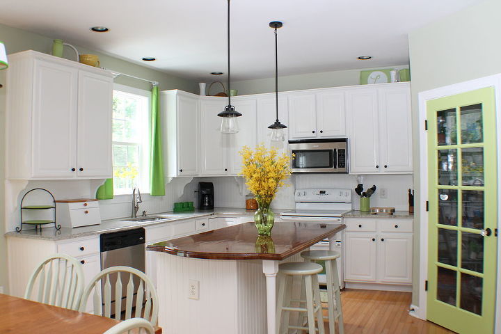 a light and bright kitchen redo, home decor, kitchen backsplash, kitchen design, kitchen island, The second stage brightening up the cabinets Visit the link for details