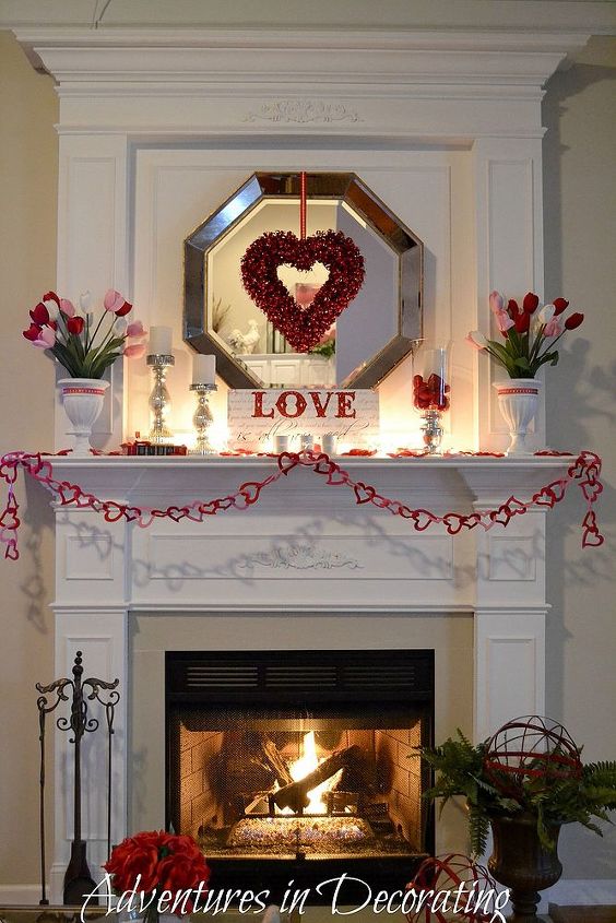 our simple valentine mantel valentinesday, christmas decorations, fireplaces mantels, seasonal holiday d cor, valentines day ideas, wreaths, A small strand of white lights and a nighttime fire help create a bit of Valentine ambiance