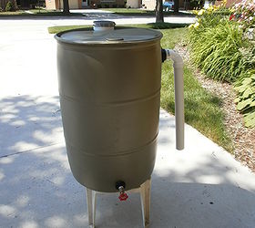 my homemade rain barrel, gardening, go green, My 1st 55 gallon rain barrel 1 coat of primer one coat of color Tested no leaks