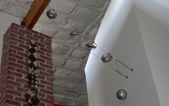 replaced existing wall-mounted fixture with suspended low-wattage spot fights