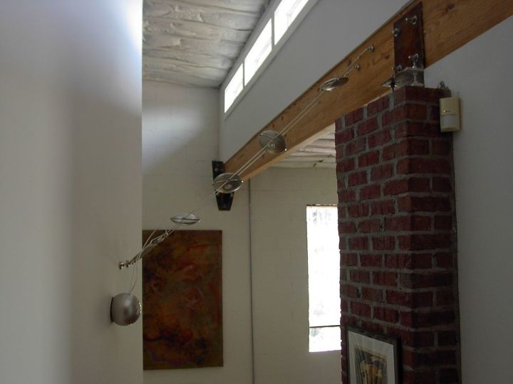 replaced existing wall mounted fixture with suspended low wattage spot fights, View at top of stairs
