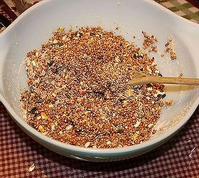 bird seed wreath, crafts, wreaths, 3 Add your bird seed and stir coating the seed well with a wooden spoon Then pour it into your greased bundt pan