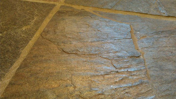 mopping a slate floor, A close up of one of the tiles to show how uneven the surface is