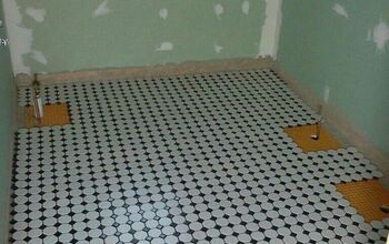 UPDATE:Hubby got the bathroom floor down today!!!:) What do ya think??