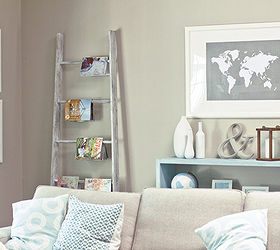 6 new uses for an old ladder, home decor, repurposing upcycling, Organize magazines Stacking magazines on your coffee table can be a recipe for clutter Avoid this problem by hanging your favorite magazines from ladder rungs instead