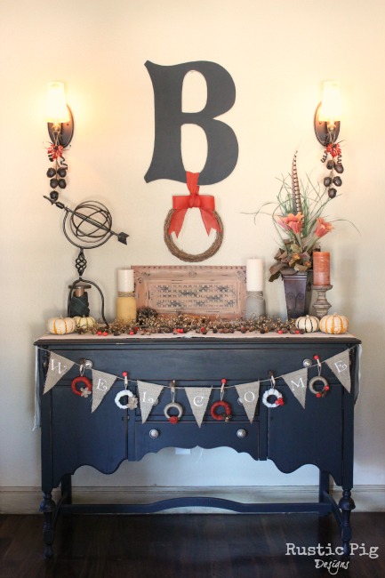 decorating for fall, seasonal holiday d cor, wreaths, Our entryway buffet all dressed up for Fall My favorite part is the garland made with mini wreaths I made from Ball jar lids