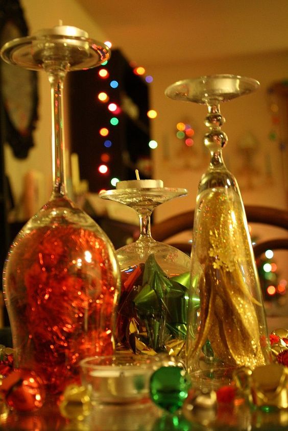 falalalala in love with glitter, christmas decorations, crafts, seasonal holiday decor, I have tons of extra wine glasses extra being the key word so I simply filled them with glitter puff balls and bows Adding a tea light on top and now I have cute unique and Holiday inspired candle sticks