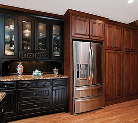 kitchen renovation, home improvement, kitchen design, The refrigerator wall includes a built in hutch with patterned glass doors and inside and under cabinet lighting The black distressed finish is a nice complement to the stained cabinetry The refrigerator is now in a central location To the right of the refrigerator are two large double door pantries with custom configured pull out drawers and shelves