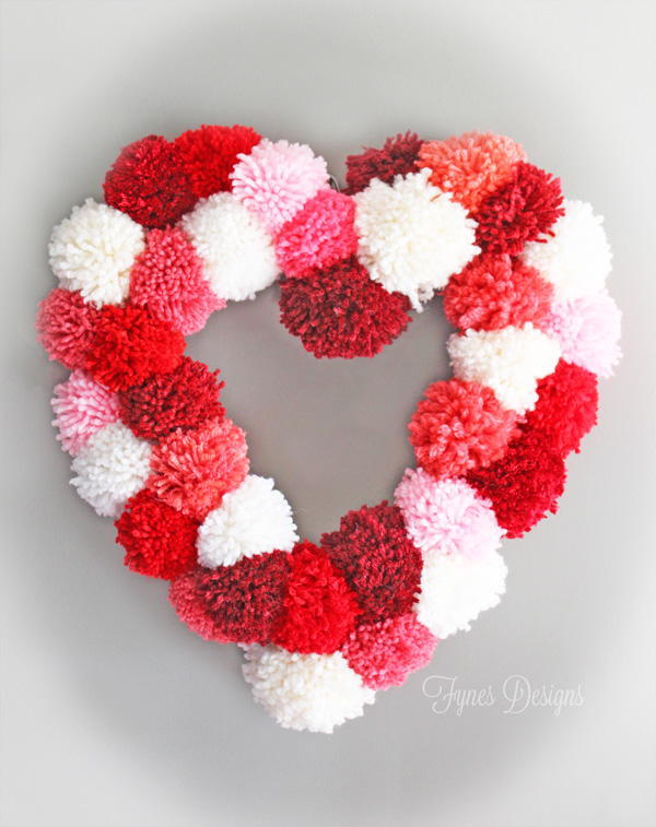 how to make a heart wreath form, crafts, seasonal holiday decor, valentines day ideas, wreaths, Tie pom poms to the wreath form to create this fun Valentines Day wreath
