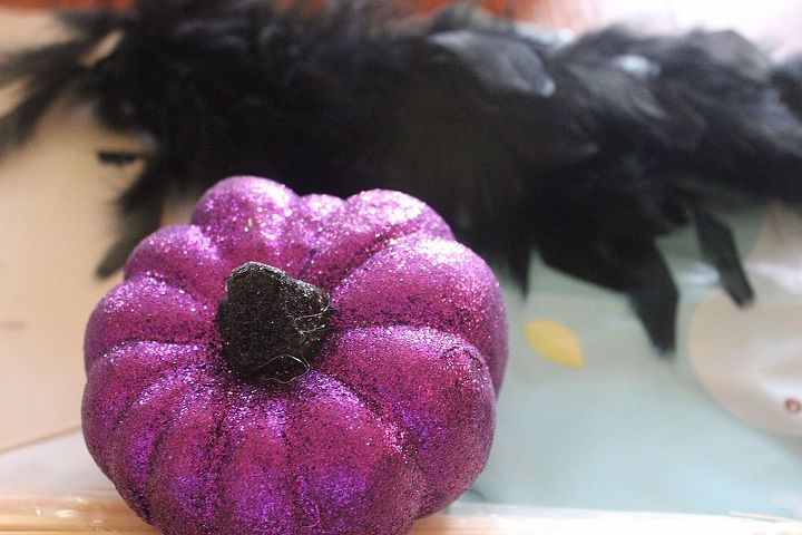 how to make topsy turvy glam pumpkins, crafts, seasonal holiday decor, Decide the order you are going to stack your pumpkins Cut a piece of the boa to be glued to the bottom of the bottom pumpkin
