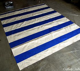 diy painted floor cloth, flooring, painting, I used a large canvas drop cloth and measured the size I needed for my room Cut the painter s dropcloth down to size leaving about an extra inch on the sides Hem the edges you can use my no sew method to make it easy