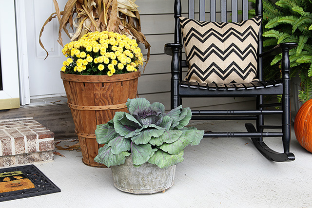 fun and festive fall porch, curb appeal, gardening, outdoor living, seasonal holiday decor, wreaths, Tall bushel baskets and old buckets hold the fall mums and cabbage kale