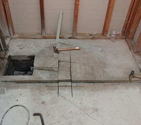 installing a zero clearance inline shower drain, bathroom ideas, diy, how to, plumbing, With the tub and walls removed concrete is cut for a new waste outlet Existing drain is removed