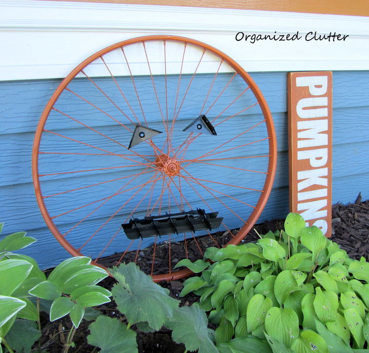 an up cycled bicycle wheel garden pumpkin, crafts, repurposing upcycling, seasonal holiday decor