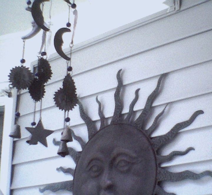a few little changes to the front porch yard, flowers, gardening, outdoor living, Pete had the metal sun on his home I had the metal chime that matched