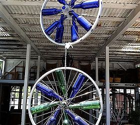 bicycle wheel wonderfulness, gardening, repurposing upcycling, How did they attach these bottles to the bike rims Does anyone know