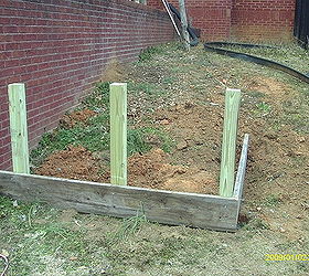 i put in a raised bed the post are pressure treated 4 x 4 s and the boards are, gardening, raised garden beds, The post are set in concrete and leveled The bottom row of boards are leveled and nailed to the post