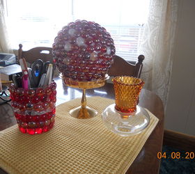 my hobby sort of half marble art, The larger ball is one of those ceiling globes the pencil holder is just a dollar store small vase the votive holder is 2 pieces of glassware i glued together