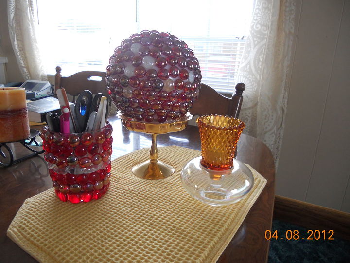 my hobby sort of half marble art, The larger ball is one of those ceiling globes the pencil holder is just a dollar store small vase the votive holder is 2 pieces of glassware i glued together