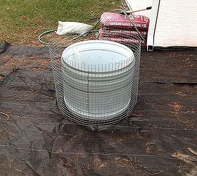 gabion planter from defunct clothes dryer, Hardware cloth cut larger than the drum and secured in the middle with wire ties Landscape pins secure the wire mesh to the ground