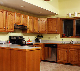 5 top wall colors for kitchens with oak cabinets, kitchen design, paint colors, painting, wall decor, In the 90 s the look was to paint walls in various shades of yellow But as you can see from this example below it did nothing to enhance the wood and clashed with the tile Via Forums The Nest