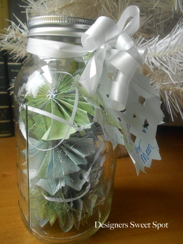 map garland in a jar, crafts, repurposing upcycling, seasonal holiday decor, The paper rosettes fit neatly into a 2 quart mason for gift giving and storage