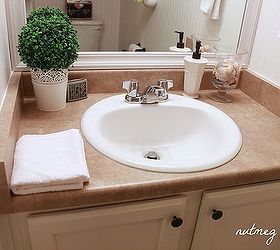 quick powder room makeover, bathroom ideas, home decor, Cabinet painted hardware added and mirror framed