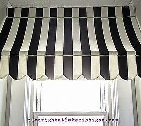our window seat family library, diy, home decor, how to, storage ideas, The awning is actually tension mounted between the two bookcases making it incredibly easy to remove while tying in the stripes of the cushion and adding a sense of whimsy to the whole area