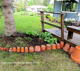 making a terra cotta pot flower bed edging, flowers, gardening, perennials, I like the idea of lining them up smallest to largest but they could be all the same size too