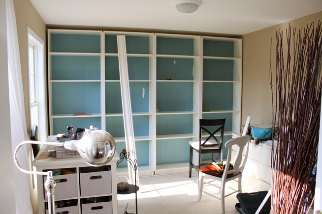 built in bookcases, craft rooms, storage ideas, We slid the four bookcases into place and surrounded it with trim to build it in