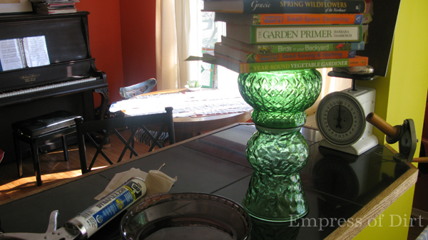 Join the pieces in pairs, allow them dry, and then join them all together to form the totem. Here I'm using books to press two freshly-joined pieces together while the sealant dries.