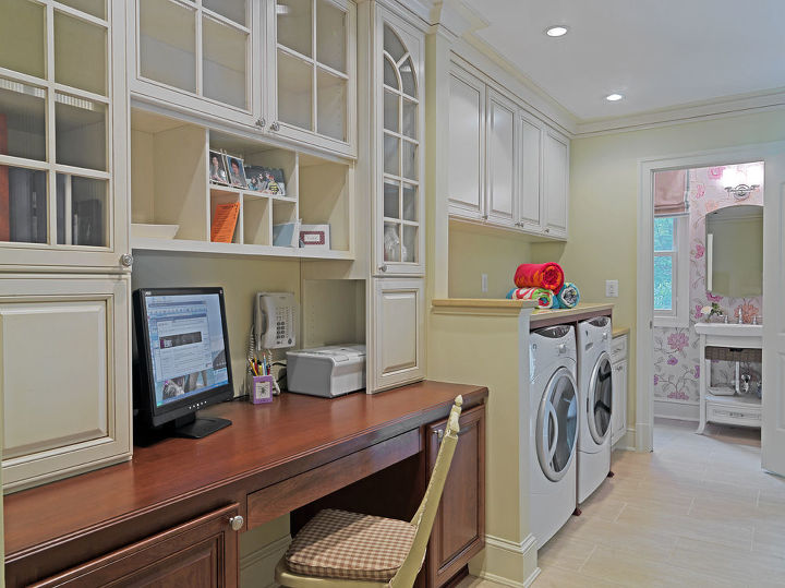 The homeowners challenged our creativity by asking for a home office, laundry room, pool dressing area, pantry (not shown), and powder room in one small space while maintaining an open feel but making sure they all felt like separate spaces. Our designers made sure the space was functional and provided ample countertop areas and storage.