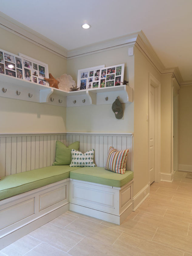 The pool dressing area sits just inside the house adjacent to the laundry room. It provides the family with a place for pool guests to drop off their belongings before heading out to the pool, a place for towels to dry, and the piano hinged bench provides plenty of storage for pool related items so the room doesn't get cluttered.