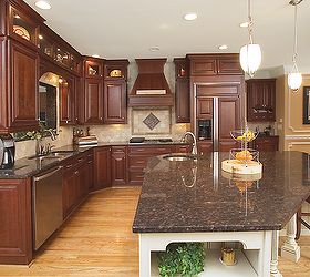 true atlanta elegance take a look at these dramatic before and after images of, home decor, kitchen backsplash, kitchen design, kitchen island, The main kitchen is traditional in style with a custom island to accent the rich woods The granite is Tan Brown