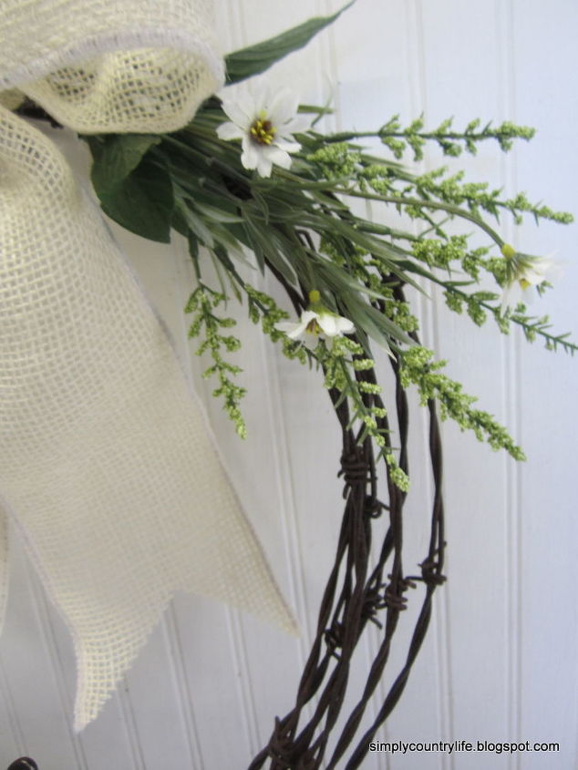 barb wire and horseshoe wreath, crafts, repurposing upcycling, seasonal holiday decor, wreaths, I also added white daisies and green floral sprays
