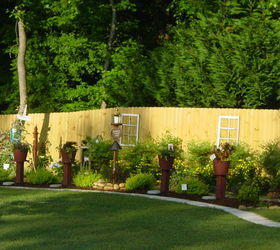 honored to host our first home garden tour this spring, flowers, gardening, outdoor living, We made raised planters from pieces of posts and lumber that my brother in law had left from a project We made them portable by drilling holes in the bottoms of the posts and inserting long iron rods that are driven into the ground