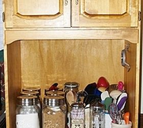 entertainment center repurpose and upcycle, Recently I got these really cool mason jars that I am using as canisters My big spatulas etc are in crocks I have collected over the years We took the lazy Susan out and made the table with some arbor wood