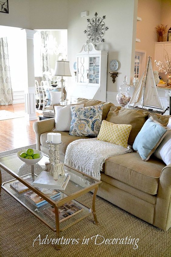 tweaks in our summer great room, home decor, living room ideas, More summery pillows fill the sofa