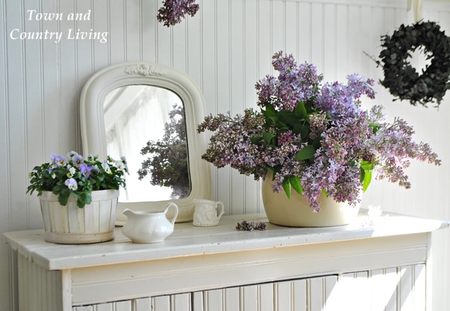 tips for decorating with fresh flowers, container gardening, flowers, gardening, home decor, A big bunch of lilacs are tucked into an enamel pot No need to arrange in a formal display just let them spill over the sides