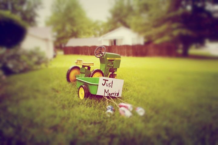 decorating ideas for shabby chic wedding event, home decor, shabby chic, This was probably one of my favorite additions to the decor The vintage tractor pulling the cans Just fun