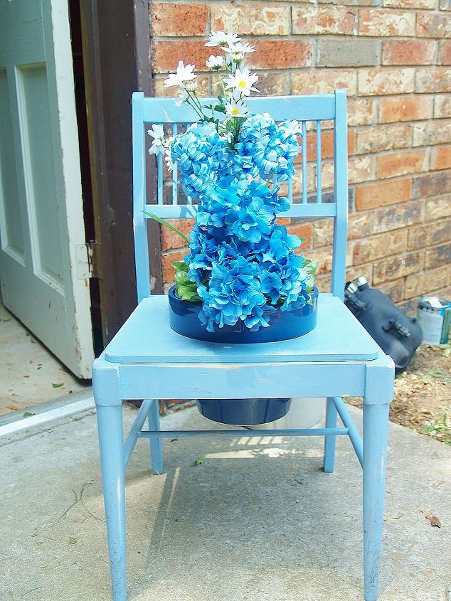 yard sale repurpose upcycle, repurposing upcycling, Plops in the blue ceramic planter and I put the blue flowers in for the shot I think geraniums or daisies would be perfect
