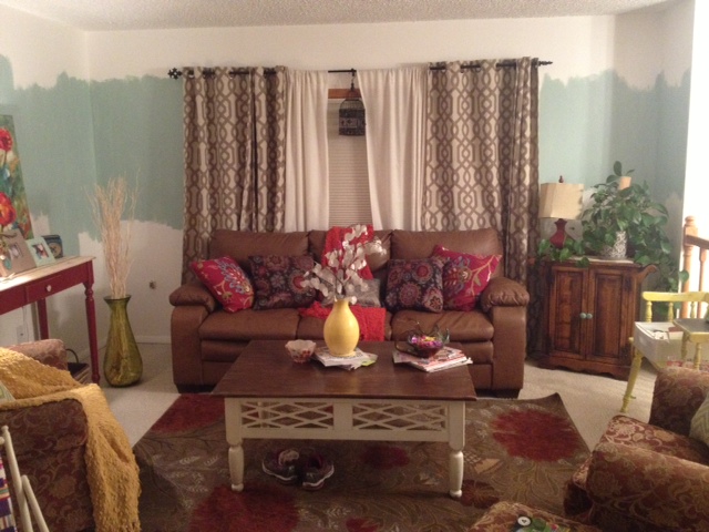 need help on how to paint a raised ranch open floor plan, Here is the living room The small sofas will have slip covers and the rug will change and so forth The room is not decorated yet but the pillow is going to be my color palette