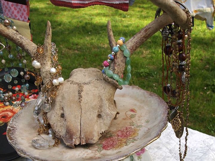 how to host a successful yard sale, Have a sense of humor when staging items Untangle jewelry and hang it