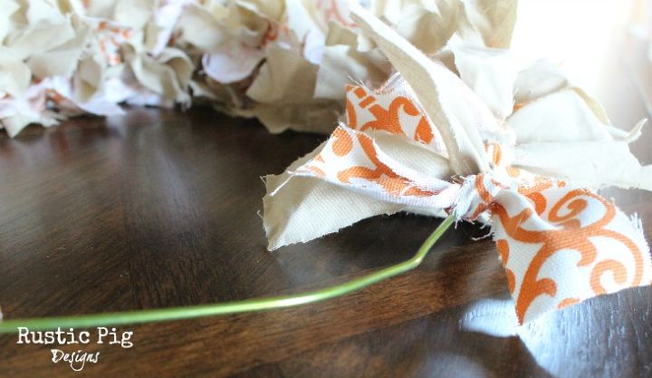 coat hanger fall rag wreath, crafts, seasonal holiday decor, wreaths, Tie pieces of fabric to the wire coat hanger Be sure to push them together so they are tight