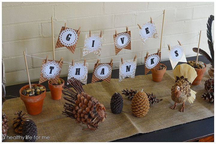 thanksgiving diy banner, crafts, seasonal holiday decor, thanksgiving decorations, Scatter pine cones around the table followed by a few candles and any thanksgiving decor you may have I added two cute little turkeys I found at Target
