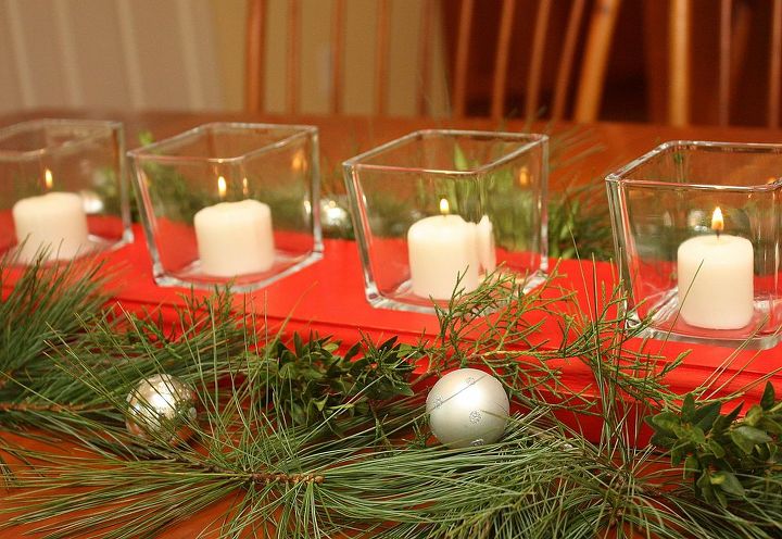 diy recessed glass votive wooden centerpiece, christmas decorations, flowers, seasonal holiday decor, woodworking projects, Red paint candles greenery and Christmas balls makes this a pretty centerpiece for the holidays